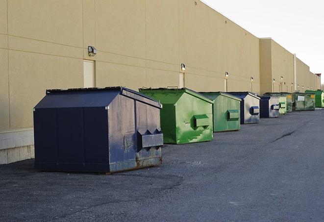 waste disposal bins at a construction zone in Bunkie